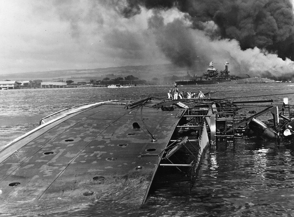 The capsized minelayer USS Oglala with the capsized USS Oklahoma alongside the USS Maryland. #PearlHarbor82