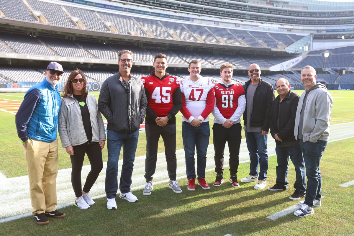 The Bernie’s Book Bank group and the founders along with the three finalists at Soldier Field.