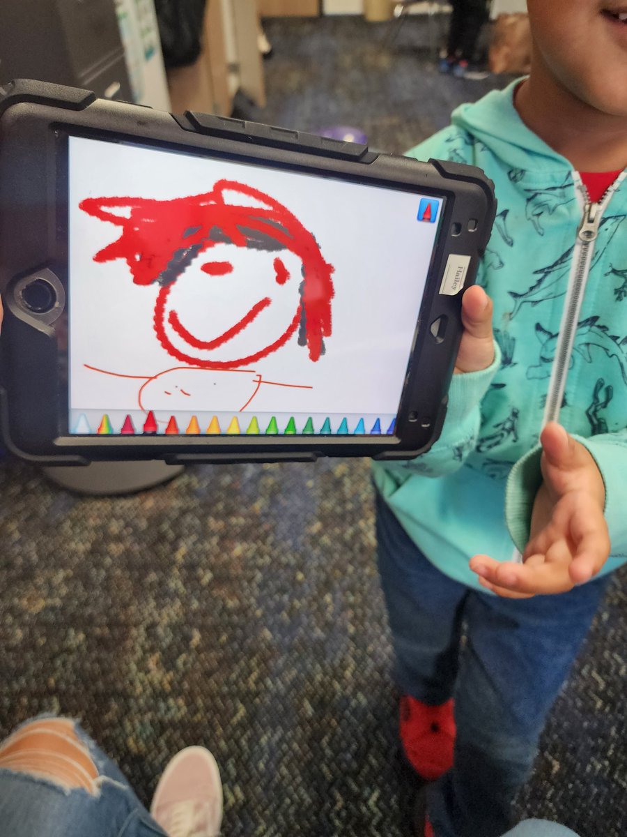 This little cutie said he likes drawing Mrs. Garza.  He said, "Look it's you, red hair".