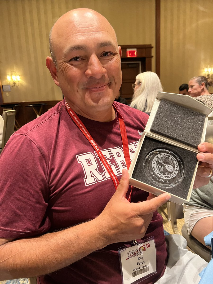 LHSRebelTennis's tweet photo. Congrats to Coach Perez for being recognized at our TTCA convention banquet for 20 years of coaching tennis🎾 #20years #tenniscoach #TTCA https://t.co/I93o1OYhYj