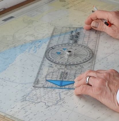 Nautical chartwork is part of our training. All training topics go from the puzzled look of concentration to the smile of understanding. Even when seen from behind, that process is obvious here! For more training info, contact mick.carter@nci.org.uk