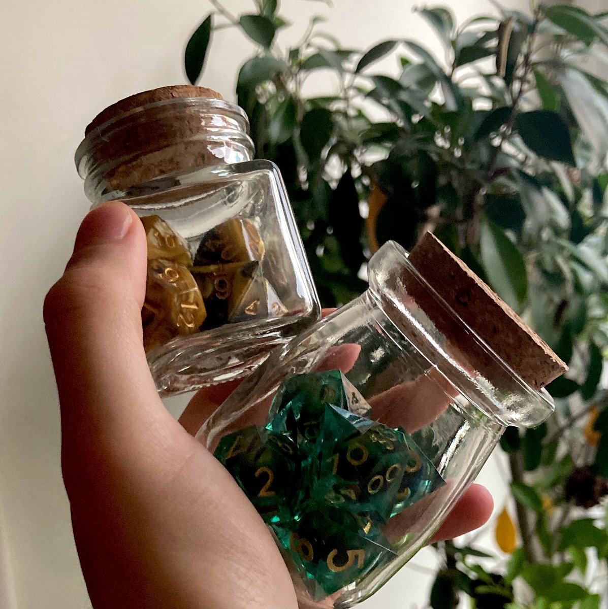 KaarnDreksh's tweet photo. How do you store your dices? 🎲
I love to keep my fantasy dices in glass containers
(My sci-fi ones are left in their sad cubic boxes) https://t.co/i1p2K3M12W