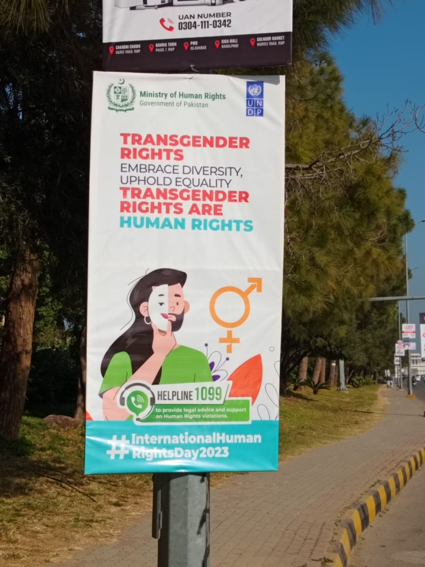 M_EssJay's tweet photo. Hanging on a side walk of Blue Area, Islamabad, this LGBTQ infested banner is owned by none other but Ministry of Human Rights, Pakistan. @mohrpakistan. As if they don't understand the difference between an intersex and a transgender. As if they don't know that an image where a fully grown bearded man is been shown, wearing an identity of a woman and as if they thought that all Pakistanis are stupids?? 

Care taker PM @anwaar_kakar is also responsible if in his cabinet a minister is peddling this agenda, which is very much opposite to the essence of our constitution, our islamic identity, scientific knowledge and a court decision by Sharia Court.