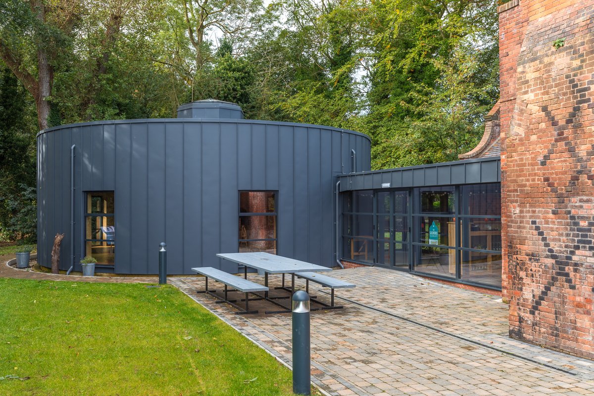 JBoonArchitects's tweet photo. Here is the extension to the @SudburyGasworks carefully designed to sit sensitively on top of the stonework base that would have been the gasholder, and clad in curved metal inspired by how the gasholder itself would have looked. @MiniapertureP https://t.co/2rwk5Y0pcm