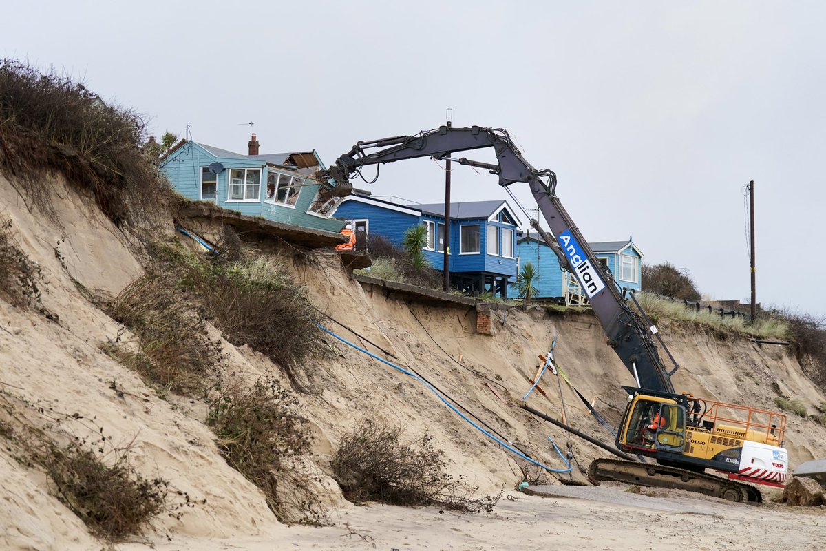 Demolition begins on five clifftop homes in the village of Hemsby in Norfolk which has been hit by coastal erosion. High tides and strong winds caused the collapse of a stretch of private access road in Hemsby in Norfolk last month