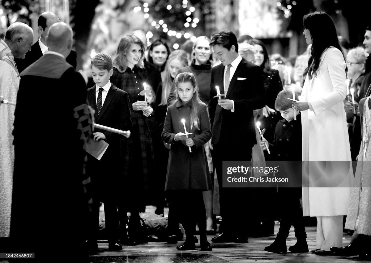 Princess Charlotte holds her candle as she processes out of last night’s ‘Together at Christmas’ Carol Service at @wabbey