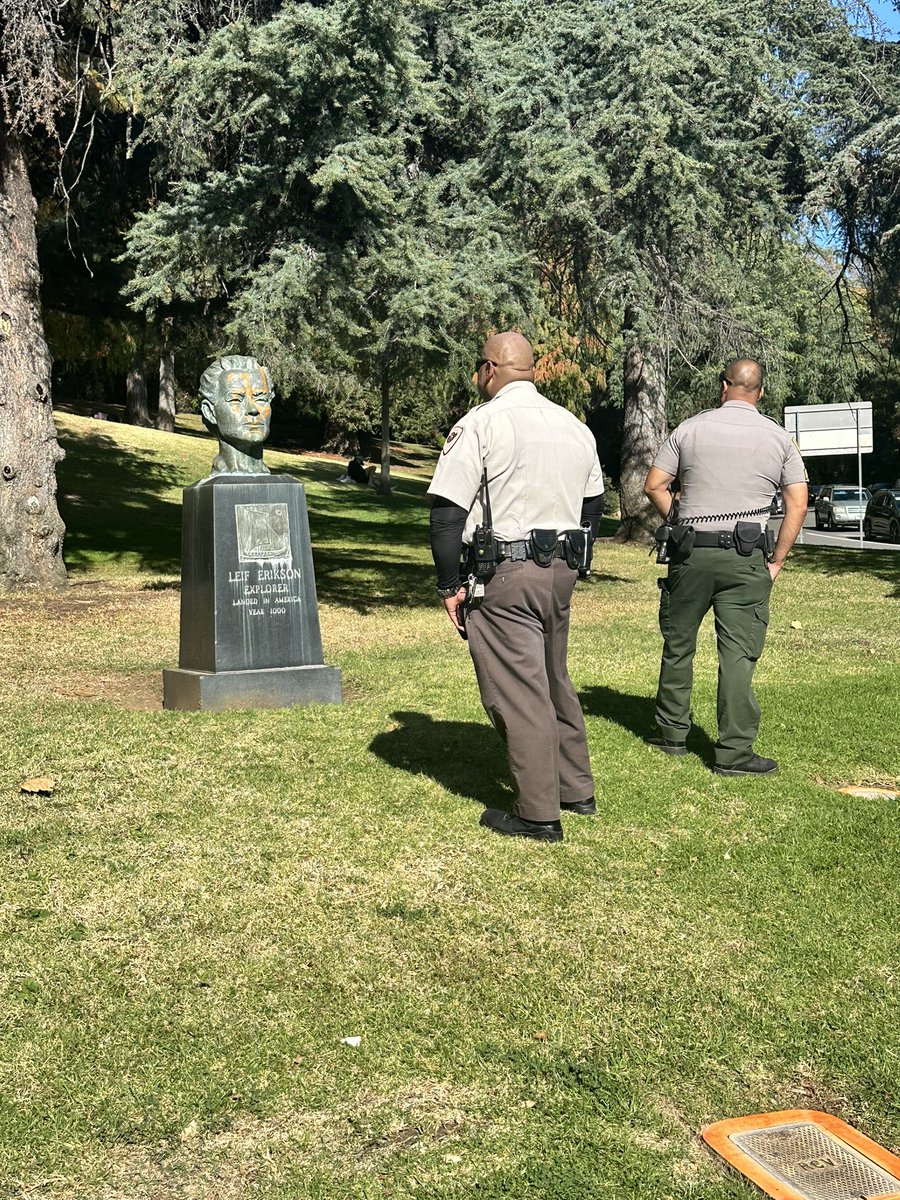 2BMatHerman's tweet photo. If the parks aren’t safe from hate wtf is?! This is so messed up someone sprayed a swastika on the bust of Leif Erickson at  Griffith Park. Glad to see that the LA Park Rangers took this matter seriously and quickly. @MayorOfLA https://t.co/3w7u9WytWe