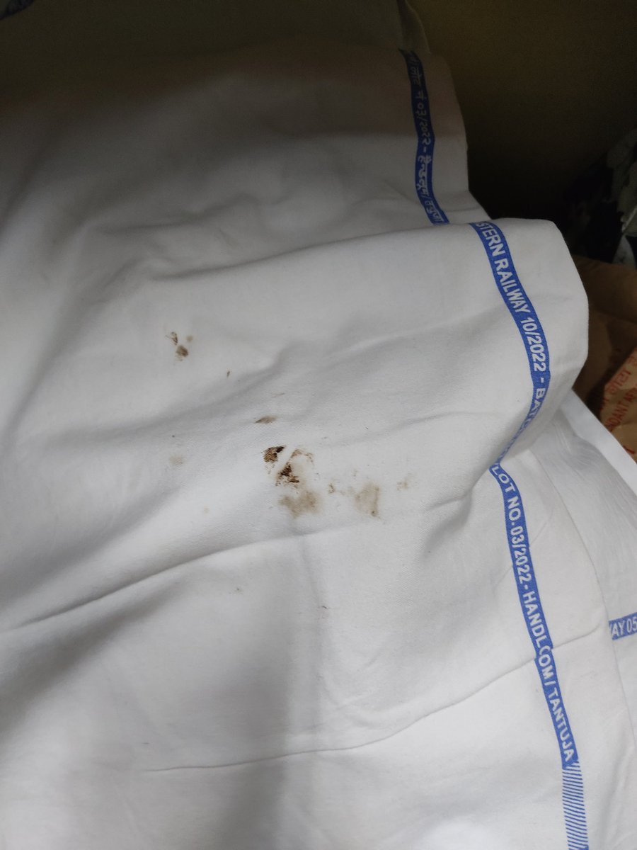 We are onboard the Howrah-Kalka Netaji Express. Thank you <a href="/IRCTCofficial/">IRCTC</a> <a href="/RailMinIndia/">Ministry of Railways</a> <a href="/AshwiniVaishnaw/">Ashwini Vaishnaw</a> for such clean bed rolls. 
This is just one of the many dirty sheets. Many have oil stains. An elderly co-passenger is sleeping without one. TY so much for the service. ☺