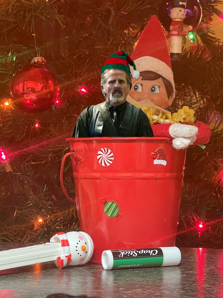 December 9th - FUCKING IMPOSTER!!!!!!! 
#IzzyHands #OFMD #OFMDIzzy #ourflagmeansdeath #ofmdfanart #IzzElfOnAShelf2023 #ConOneill #photoedit #holidays #christmas #elfonashelf #productplacement #chapstick #pez