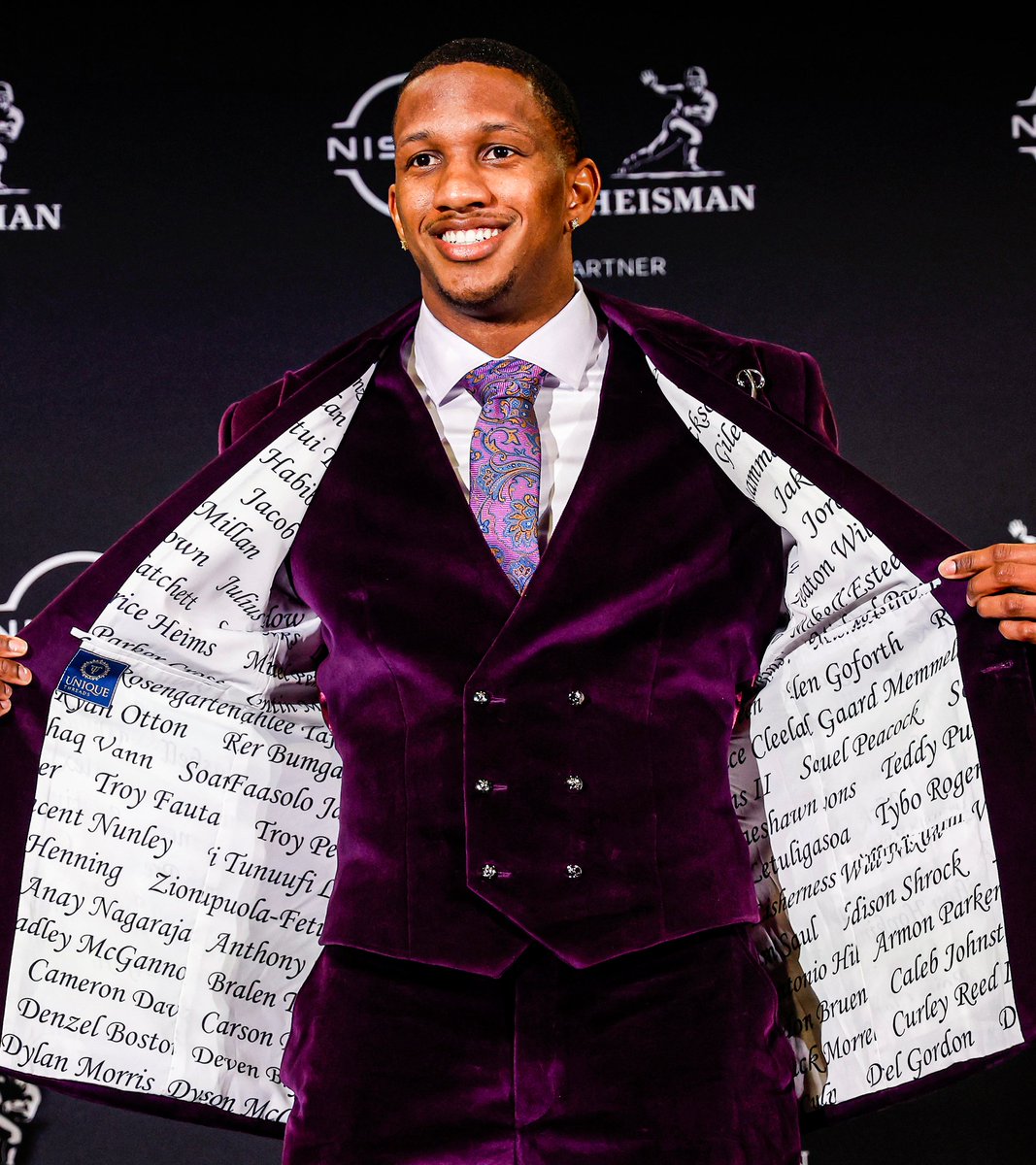 The inside of Jayden Daniels' jacket tonight has photos of him hitting the Heisman pose.

This inside of Michael Penix's jacket tonight has the names of all his Washington teammates.