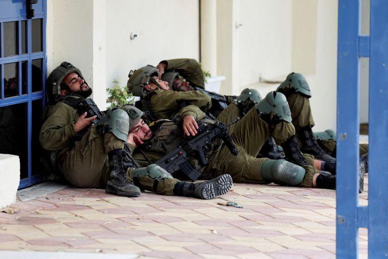 Our heroes resting after a hard day's work of killing kids.