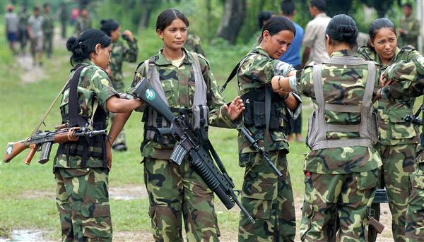 Female guerillas of Nepal's Maoist Front armed with an interesting mix of firearms - M16A2/M-203, Indian INSAS, and Ishapore 1A1 rifles. 2000s period.