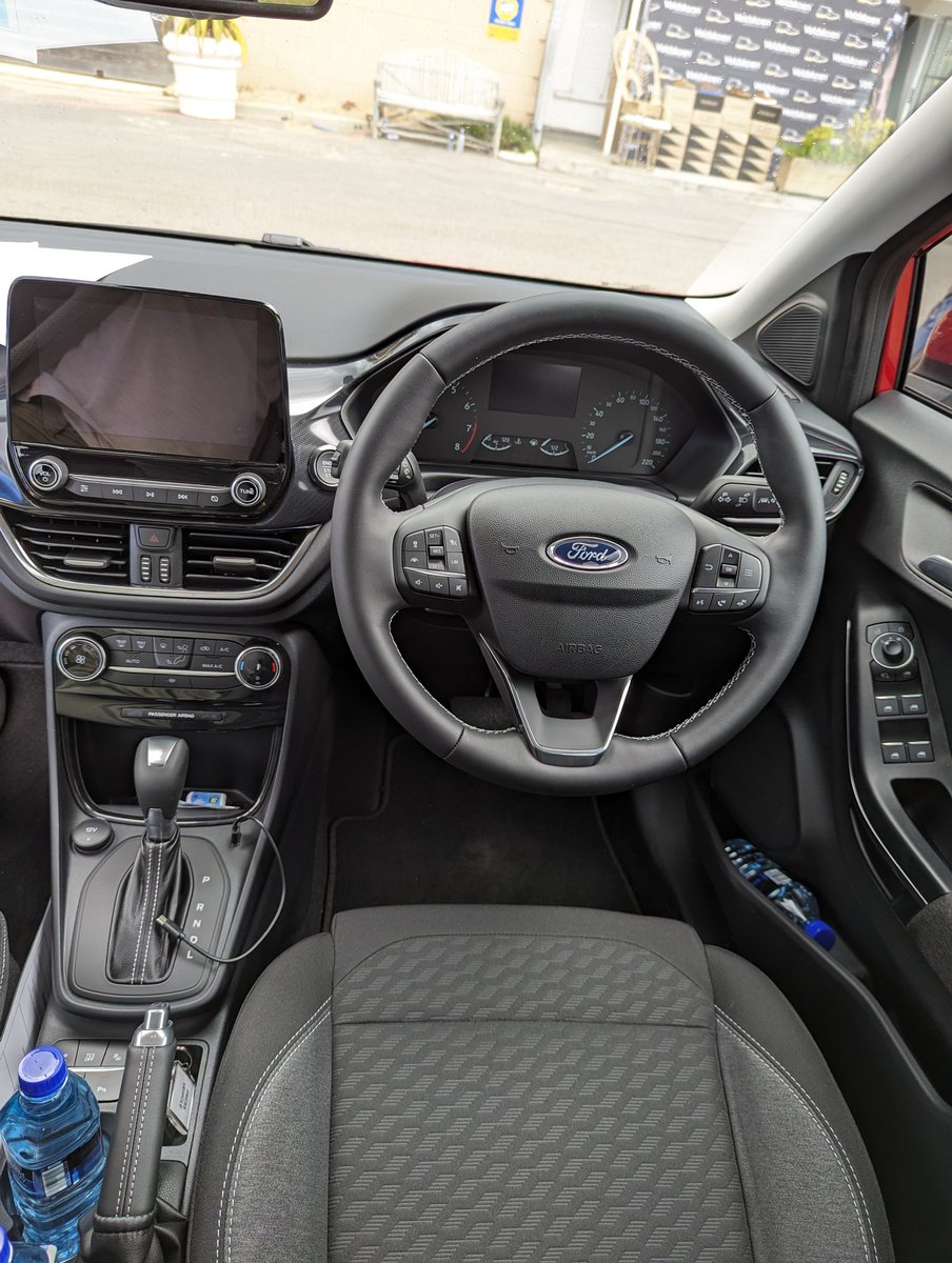 Interior of ST Line. Cloth seats but leather steering wheel and gear lever. Build quality appears to be good with blend of premium materials.