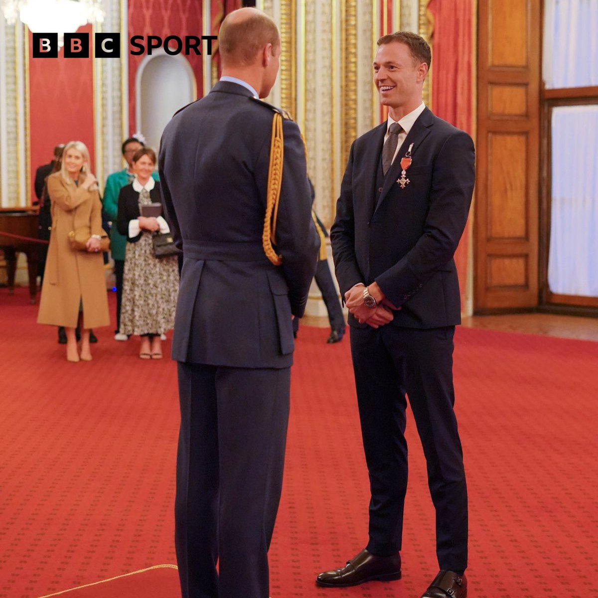 Northern Ireland and Manchester United defender Jonny Evans receives his MBE from Prince William at Buckingham Palace.