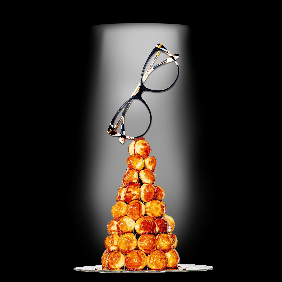 Here's our "Grand Finale" Piece, a Choux, Croquembouche with WOLFeye Rum spiced caramel, and a orange and basil infused cream filling, crowned with our favorite, glamorous and bold, 3148 frame.

#GBBO #PleaseGiveUsAPrueval #PruesAnEyecon