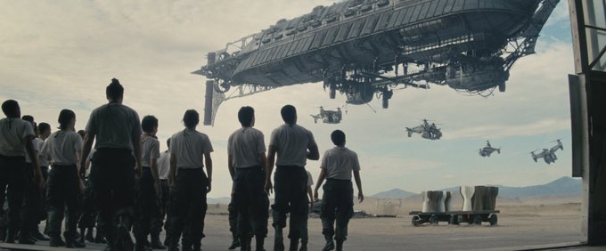 A group looking up at a number of airships in the sky from the upcoming Fallout series on Prime Video