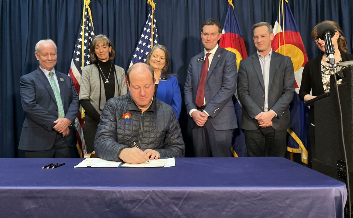 benamurrey's tweet photo. Last week #coleg wrapped up a special session that was supposed to provide simple, clean property tax relief.

Below, Polis signs the special session bill to redistribute $182.5 million from your TABOR refunds to special interests.

That's not property tax relief.

#copolitics https://t.co/c0JOZYK1BS