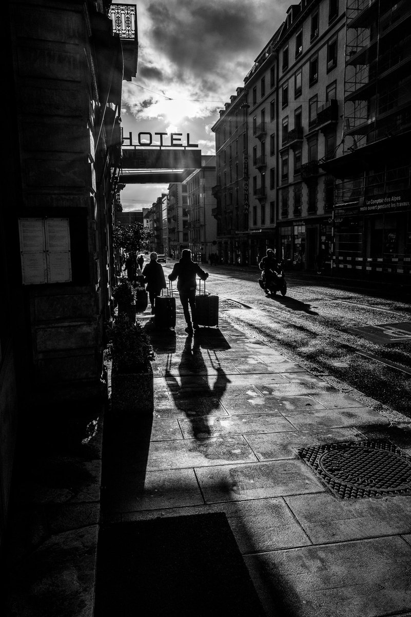 Long shadows and silhouettes, Geneva Copyright Kieron Beard #leicacamera #streetphotographer #silhouettes #shadows #hotel #streetphoto