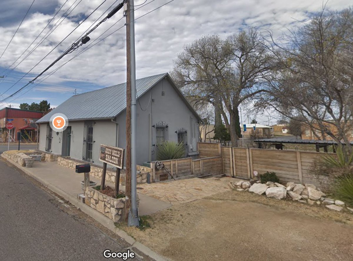 TracesofTexas's tweet photo. This is the Grey Mule Saloon in Fort Stockton, sometime after it was built to supply/service the original fort in the 1880s but sometime before the second photo, which is a Google Streetview from 2019. It's located at 101 E. Callaghan in Fort Stockton. Still going strong 130 years later, the Grey Mule has a historical landmark designation and is across from the Annie Riggs Hotel (now a museum) on South Main Street. The adobe walls are 22 inches thick. Every time I go through there I tell myself I need to stop but I never seem to think of it while I am actually passing through.