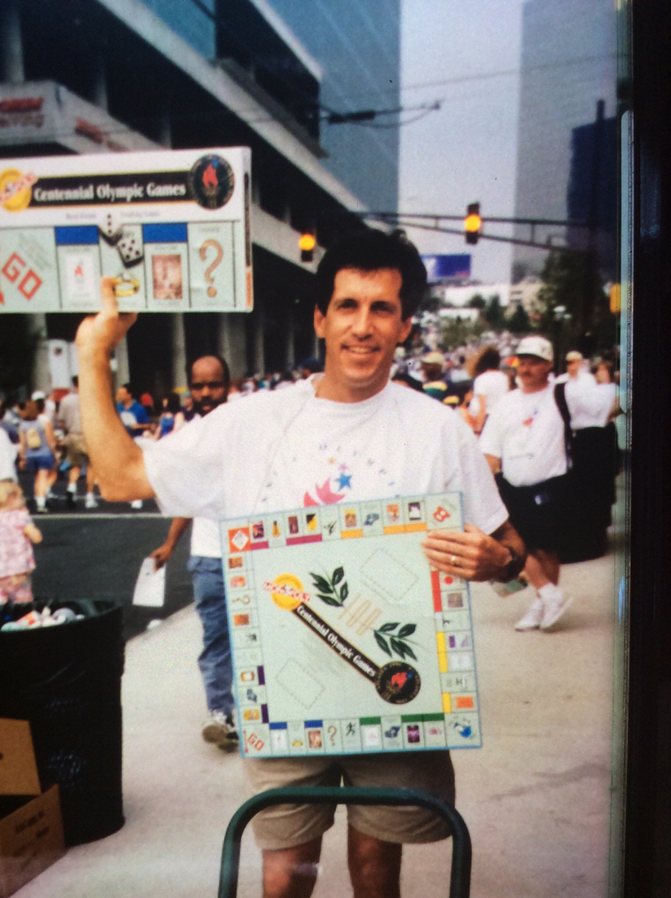 TheOpGames's tweet photo. Did you know that The Op began with our CEO selling 20,000 copies of the Atlanta Olympics Monopoly one by one on the streets?

While the company was around for a couple of years prior, this tremendous feat sent us to new heights and laid the groundwork for The Op you know today! https://t.co/Oa3zyt3G9r