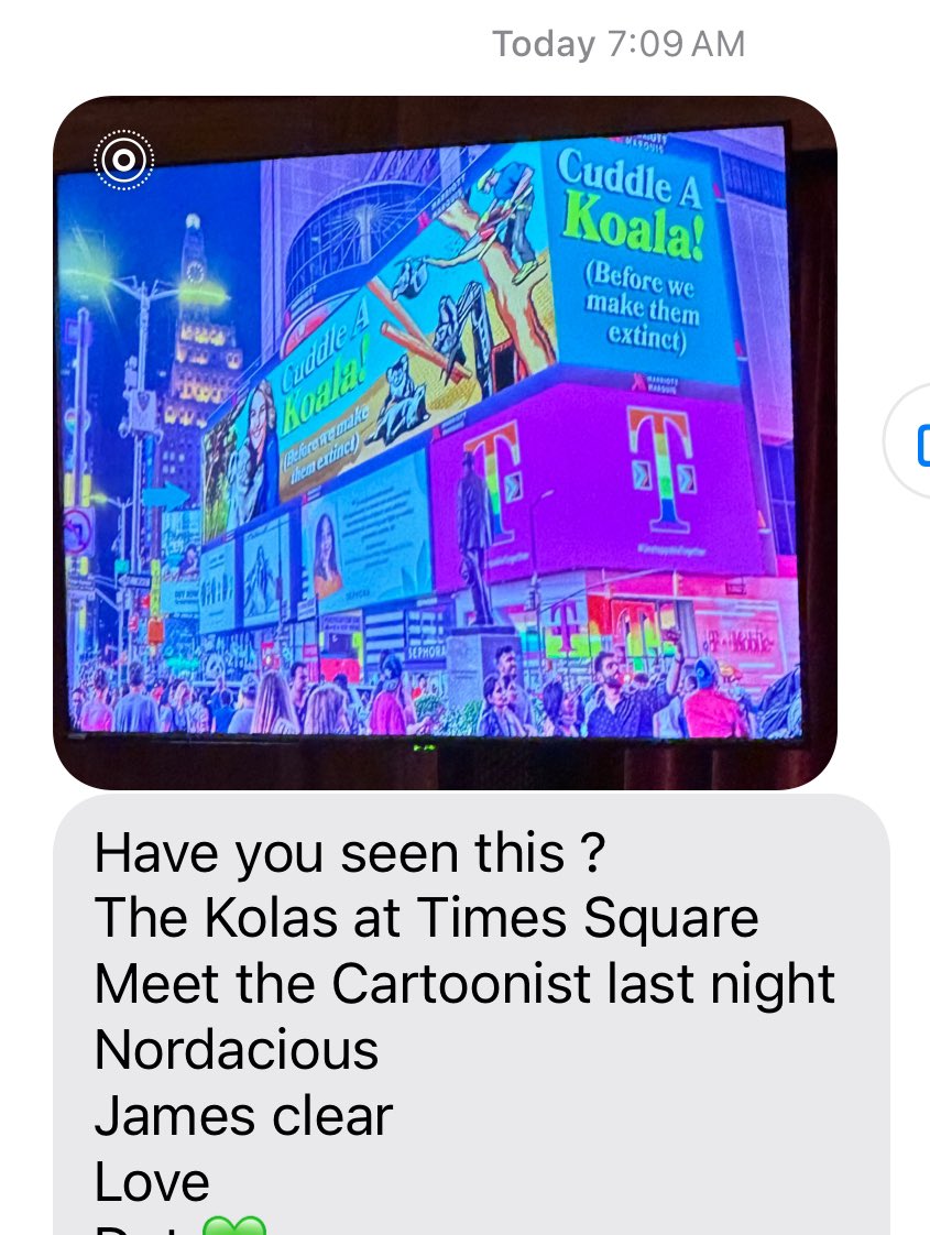 My friend visiting US sent me pic of “Cuddle a Koala before we make them extinct” cartoon in Times Square! #koala