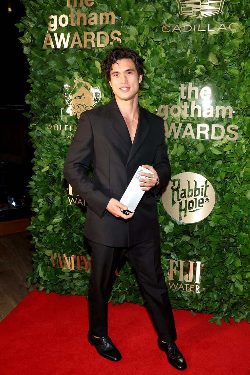 Charles Melton holding the trophy he won at the #GothamAwards? That's what I wanna see.