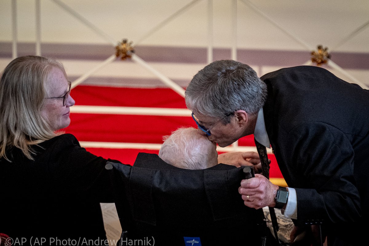James 'Chip' Carter kisses his father, former President Jimmy Carter, after speaking during a tribute service for his mother, former first lady Rosalynn Carter, at Glenn Memorial Church, Tuesday, Nov. 28, 2023, in Atlanta, as Amy Carter, left, looks on. (@AP Photo/@andyharnik)