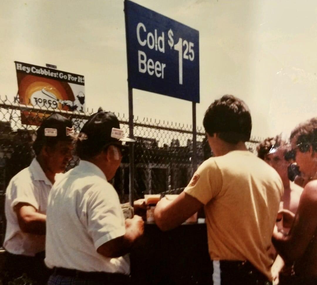 CubWin's tweet photo. Wrigley Field bleachers in 1982. 

Cold Beer - $1.25 and notice the Torco sign in the background. https://t.co/yi8cNtCfuz
