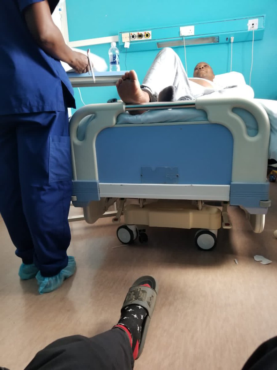 DavidColtart's tweet image. The outrages against Hon Job Sikhala continue. I am advised that he is undergoing surgery today. This photo distributed by his son shows him in his hospital bed IN LEG IRONS. Does this regime have no shame? This is a man who has never killed or even injured anyone. He has never…