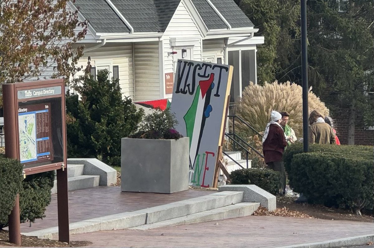 Tufts University - horrifying antisemitic signage was spotted on campus earlier today, including "glory to our martyrs".   

Defense of Hamas terrorists. 
On a U.S. college campus.
In America 2023. 

Note: some of the individuals responsible were captured in the below photo.