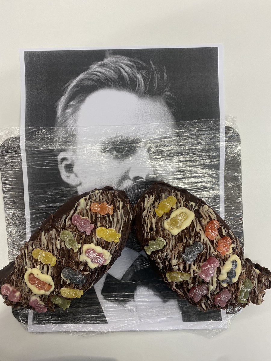 eyossarian's tweet photo. How better to spend an hour than explaining Nietzsche’s challenging ideas with a moustache cake as a prop? Brilliant to celebrate @OpenUniversity research with the @OUGradSch community at #BakeYourResearch. 

@OU_Philosophy @OUstudents https://t.co/pOWXPefeHY
