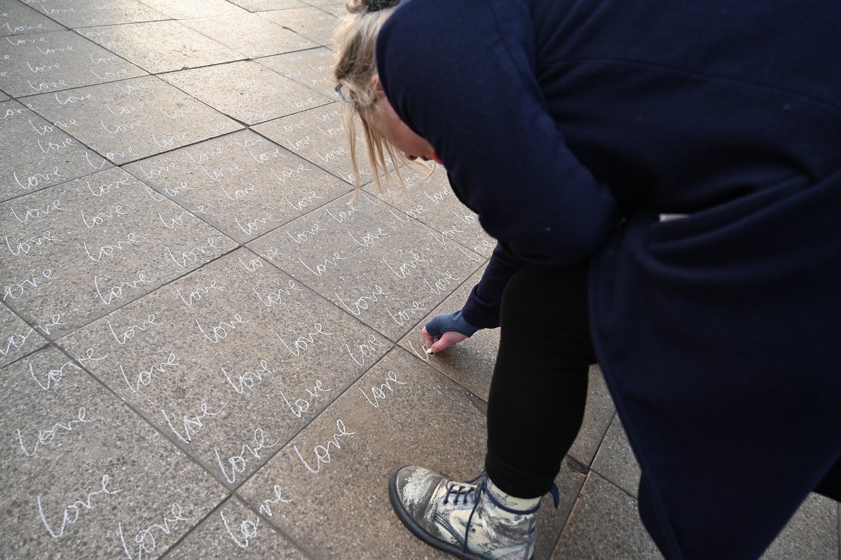 Local artist Margaret Archbold is writing the word ‘love’ across the floor of The Briggait arts hub. She says the installation commemorates the people who died and celebrates The Clutha: “Glasgow’s a community built on love and we don’t give up.” *Image by Daniel Pollitt