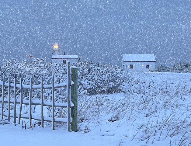 A heavy snowfall at the lighthouse this morning. We will continue to get these snow squalls all day and these are thick and heavy today. This is real snowman snow. As young children we would all be out making one.