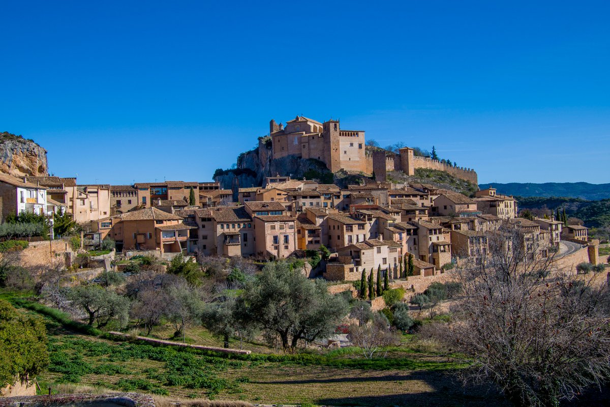 Stroll through the medieval streets of Alquézar in Huesca. This village will transport you back in time with its stunning architecture and views of the Vero River canyon. #CharmingVillages #Alquezar #huesca #spain #travel #travelling #tourist #History