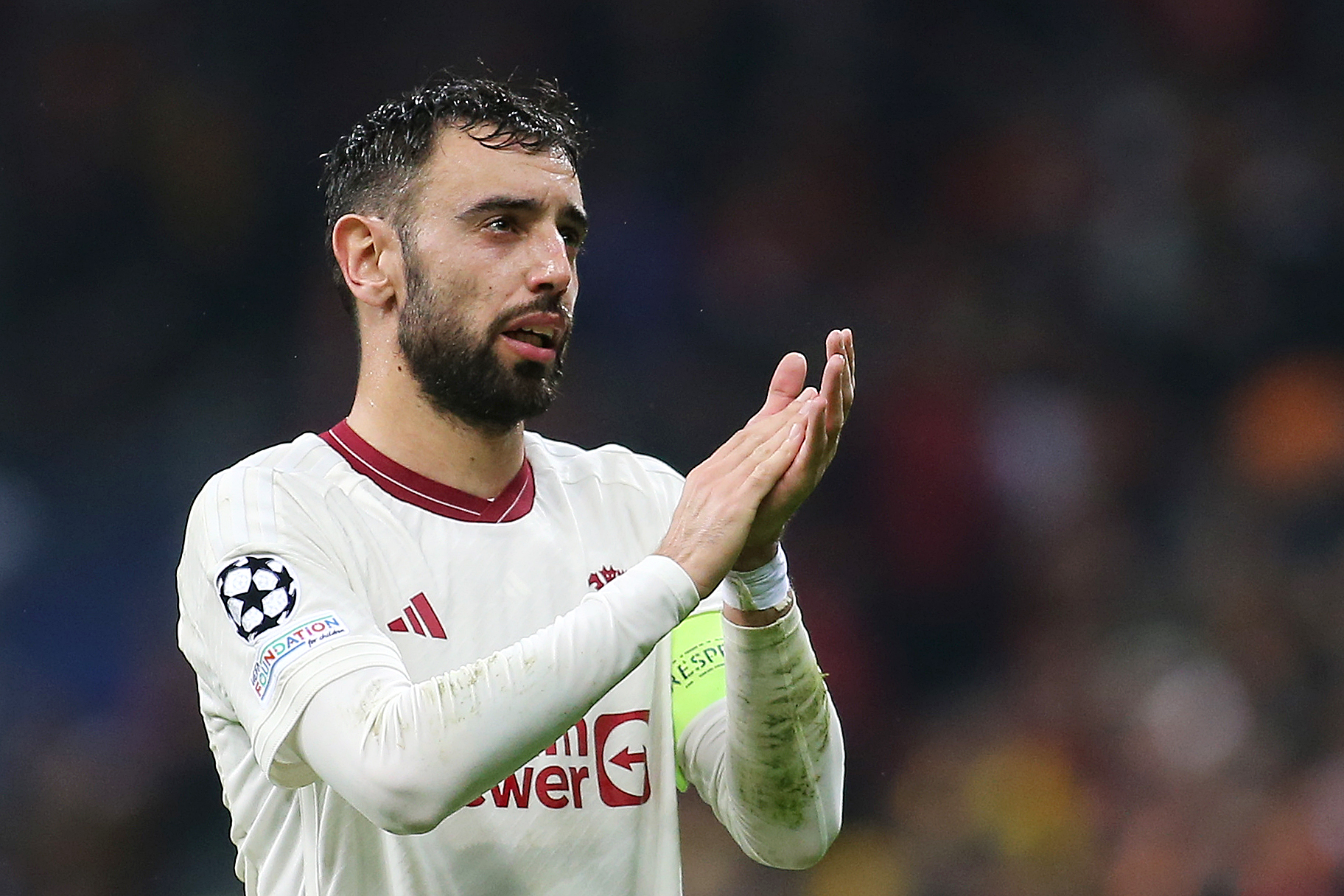 Bruno Fernandes applauds the travelling support.