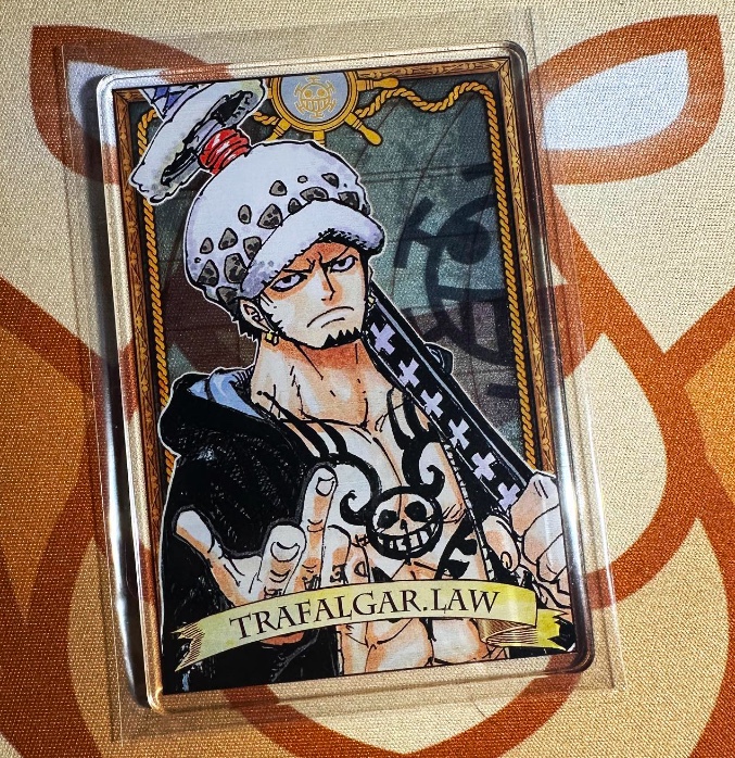_alinabrown_'s tweet photo. Acrylic Trafalgar Law 🔥🔥🔥
I wonder if these can be graded 🤔
#onepiece #onepiecetcg #onepiecesuperprerelease #superprerelease #prereleaseevent #collector #onepieceanime #romancedawn #luffy #zoro #nami https://t.co/AYjUieHfN8