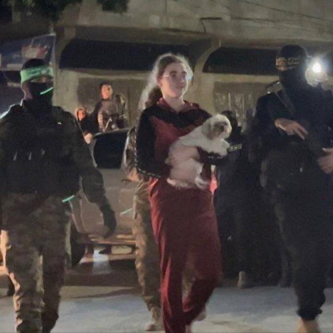 The pic that destroys the whole Western narrative.

Freed, without a scratch, carrying  her dog.