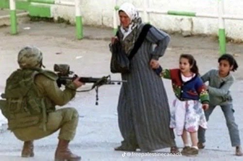 ‘And you dare to call me a terrorist as you look down your gun’.