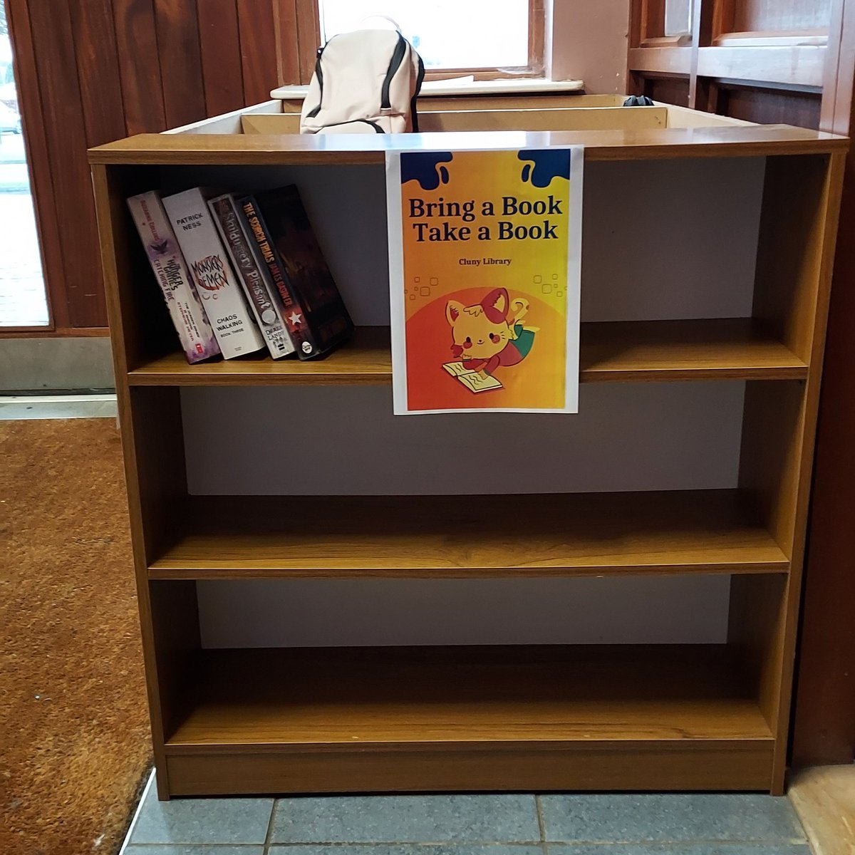 Clunylibrary's tweet photo. We've added a "new bring a book, take a book" shelf for students by the student entrance! Happy book-swapping!! 📚 #WellReadSchool @lecheiletrust1 @StJosephOfCluny https://t.co/ukOBFTWnqO