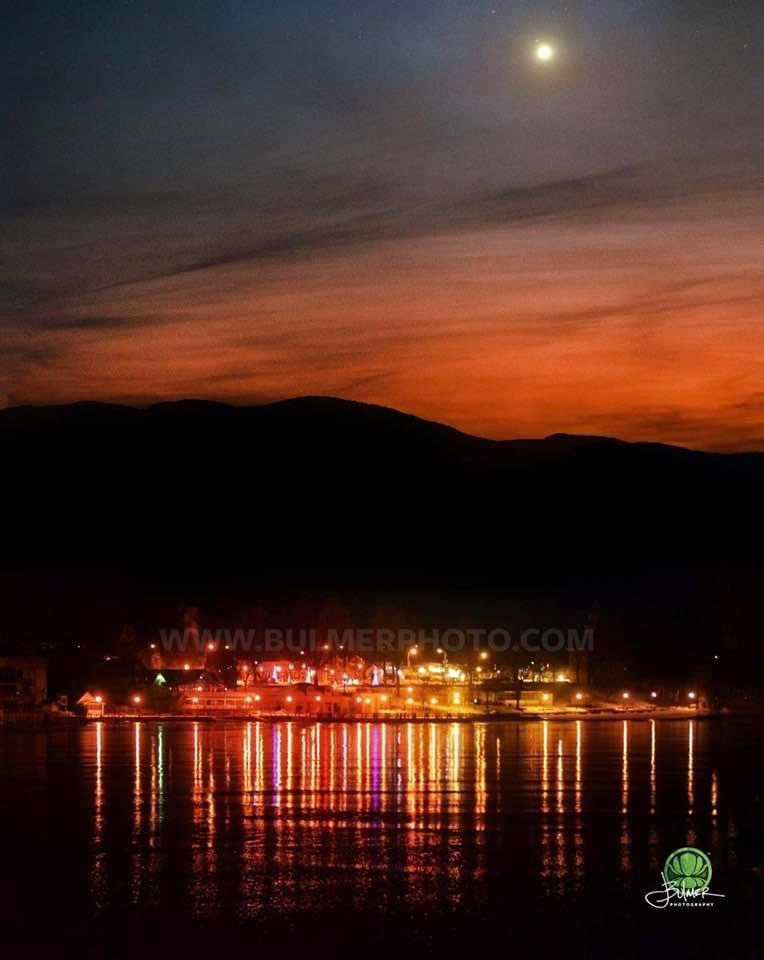 The lights of #LakeGeorge Village as the moon rises over the Southern  #Adirondacks.