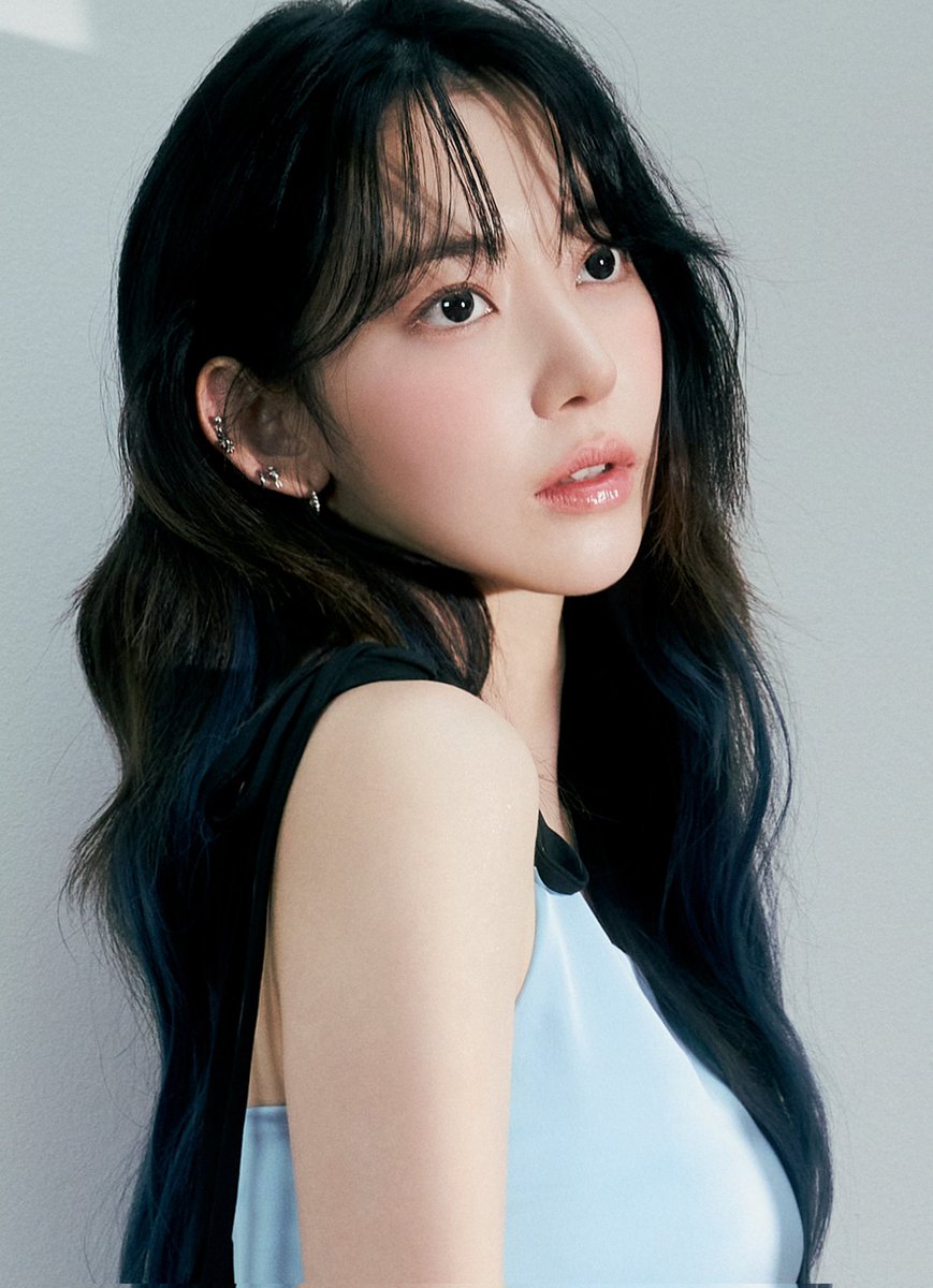 In the serenity of a tranquil moment, she stands before us, a vision of ethereal beauty that captivates the senses. Like a delicate flower in full bloom, her radiance emanates a soothing aura, casting a spell of tranquility upon all who behold her.