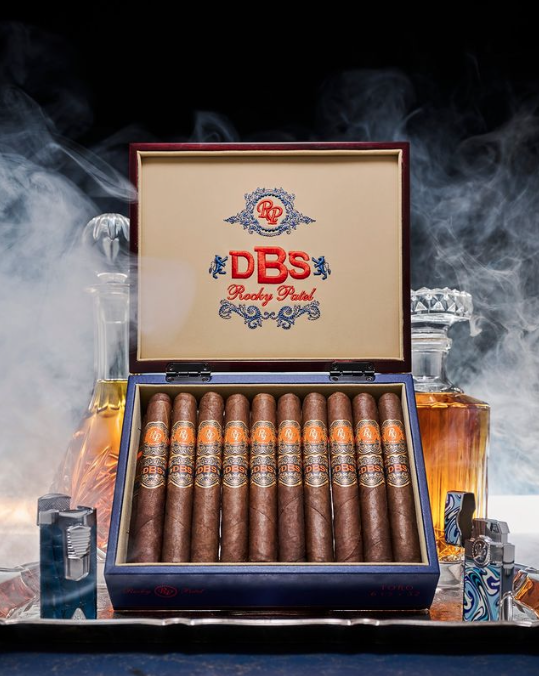 The Rocky Patel DBS, or Double Broadleaf Selection, is a full-bodied blend that's a twist on the usual broadleaf offerings. Try one and pick up some of your favorite Rocky Patel cigars at our Rocky Event featuring Nish Patel <a href="/Renegade_Cigars/">Renegade Cigars</a> on December 8th! 

<a href="/RockyPatelCigar/">Rocky Patel Premium Cigars</a>