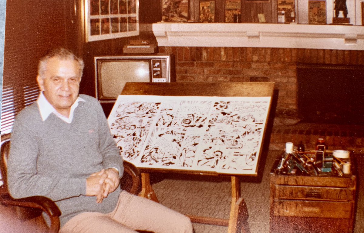 My grandfather, Jack Kirby. At his throne, artwork on the easel, inks on the side table.