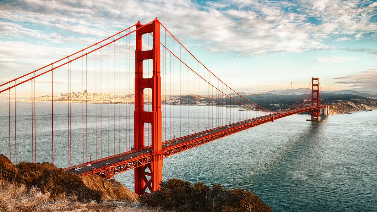 Silicylo's tweet image. The Golden Gate Bridge's iconic "International Orange" color was originally intended as a temporary primer but was later retained because it complemented the bridge's surroundings and increased visibility in San Francisco's frequent fog.