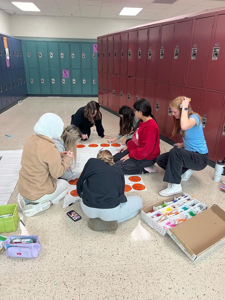 Getting signs ready for student vs. faculty game! #theEASTway #NEST