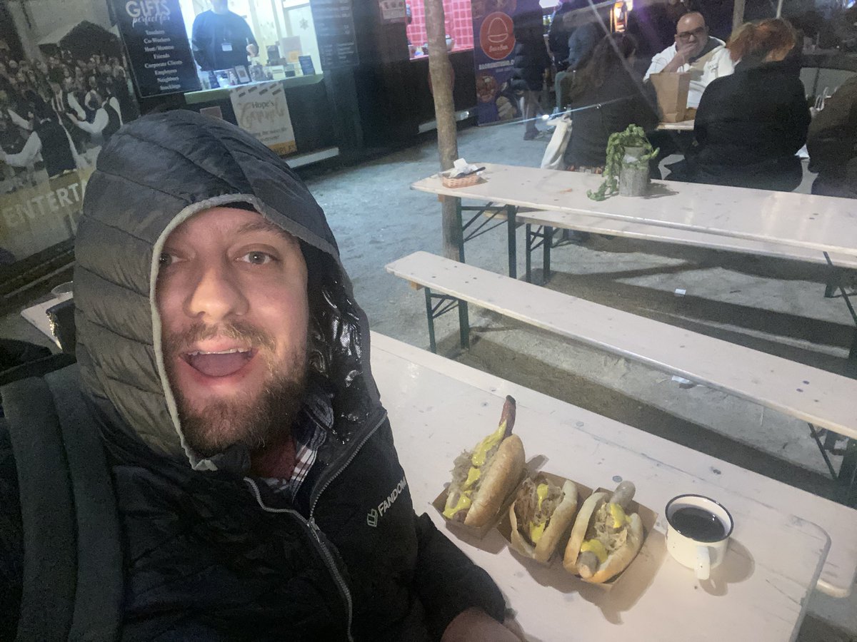 At Love Park eating brats and drinking mulled wine. Come find me and we can talk about games!