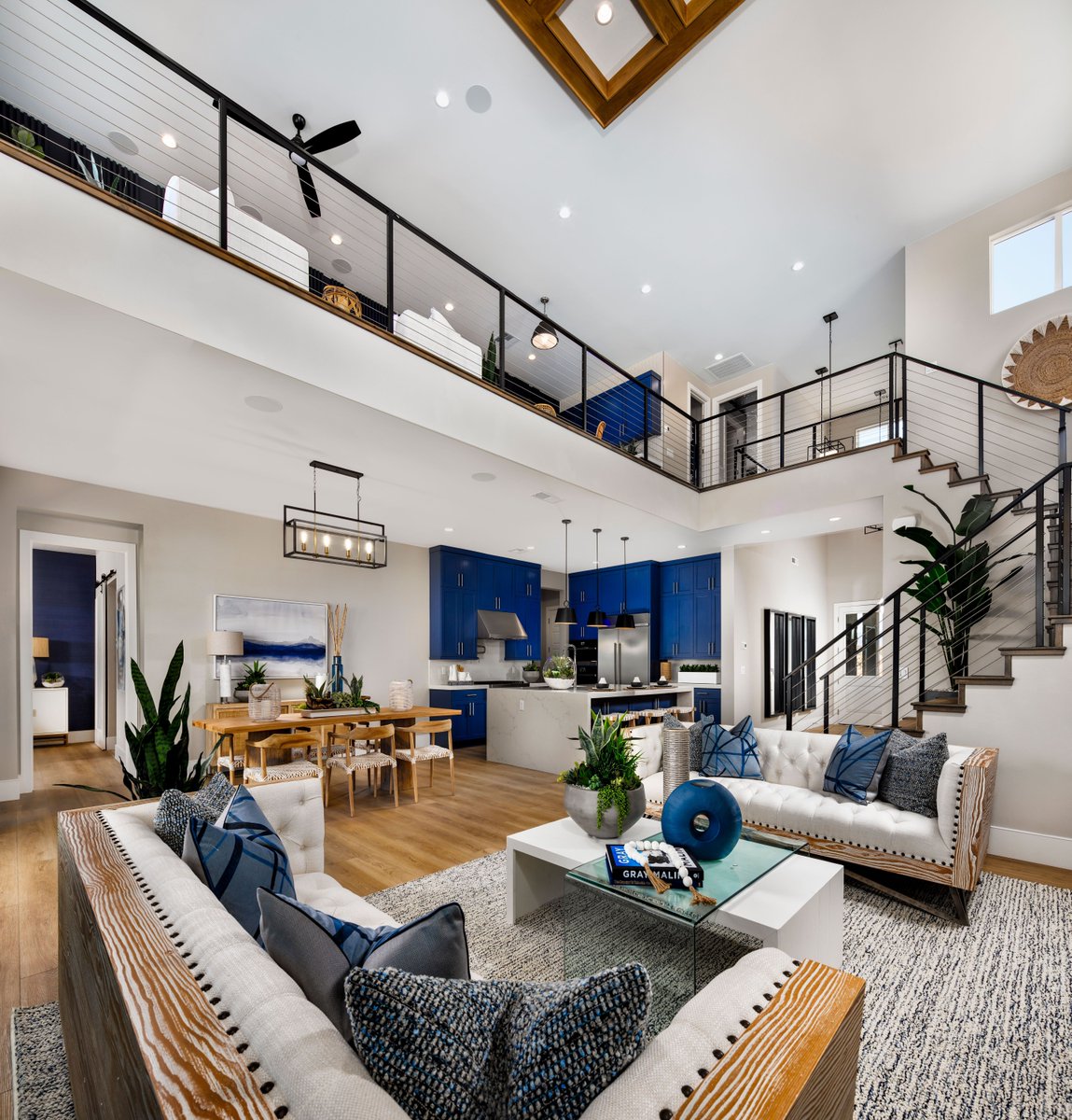 Designed to impress, the soaring two-story great room and casual dining ...