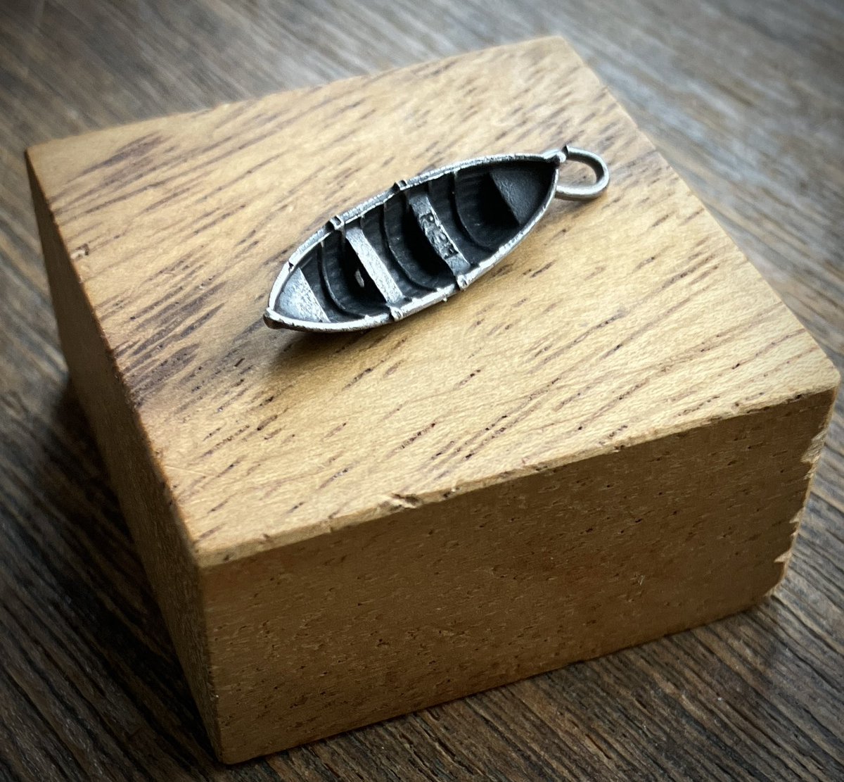 So Advent rolls round again. This year Coco has silver charms and Fliss has her usual Cabinet of Curiosities. 

 Advent Day 1/. Fliss gets a Thin section of the early land plant Aglaophyton Major, from the Rhynie Chert, Scotland. 400 million years old.
 Coco gets A Boat