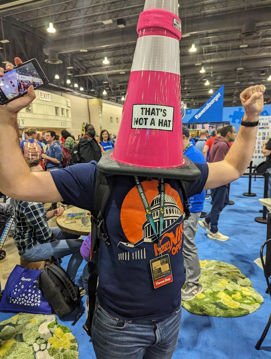 BridgeSaysWhat's tweet photo. That's not a hat!

#PAXUnplugged #Ravensburgermoment https://t.co/pAVxBQD8bu