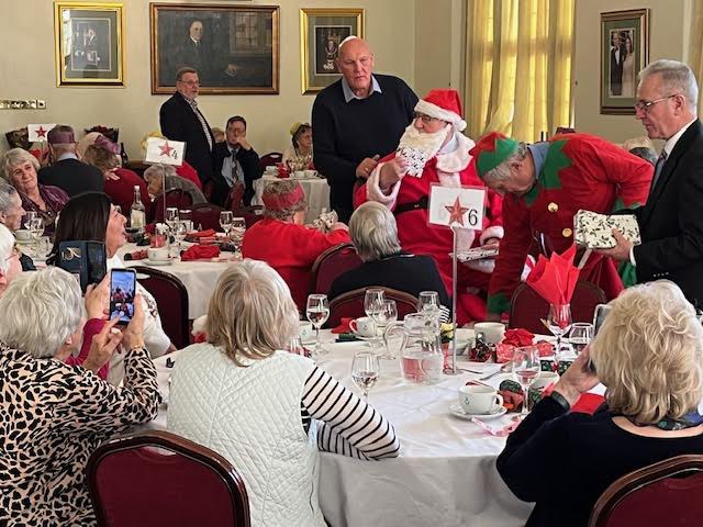 CambsMasons's tweet photo. Father Christmas, his helpers and a surprise visit by Pat Kilby the DepPGM and his wife Marion, visited Cambridgeshire Masonic Widow’s Friendship Club to deliver presents to all the ladies. https://t.co/JAbgO2dVlR